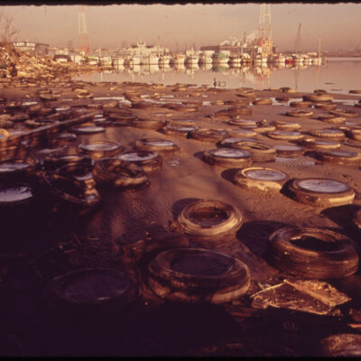 Trash and Old Tires Litter the Shore at the Middle Branch of Baltimore Harbor, 01/1973.