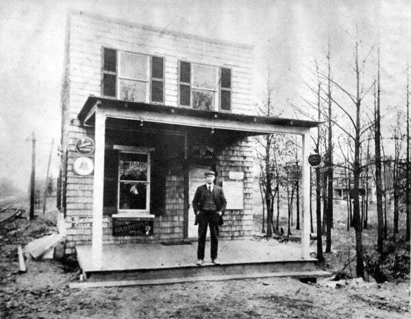Catonsville Junction, 1910. Rudolph Diehlmann poses before his lunchroom establishment. While crying out for some landscaping, the site's amenities include a pay phone. Tracks on the left are the Baltimore Traction Company's No. 14 streetcar line, pointing east toward Baltimore.