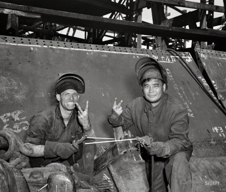 May 1943. Baltimore, Maryland. "Electric welders working on the Liberty ship Frederick Douglass at the Bethlehem-Fairfield shipyards." Photo by Roger Smith for the Office of War Information.