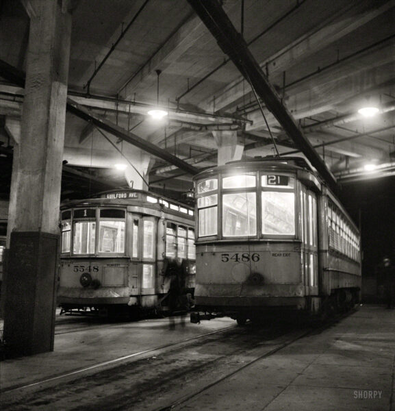 April 1943. "Baltimore, Maryland. Trolleys inside the Park Terminal at night." Photo by Marjory Collins for the Office of War Information.
