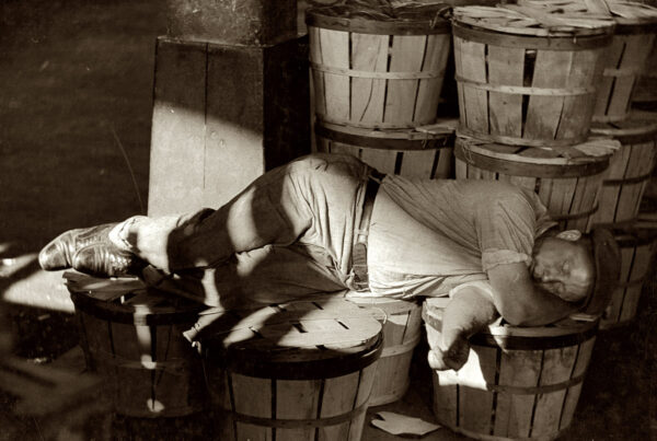 July 1938. Man sleeping in the Baltimore fish market. View full size. 35mm nitrate negative by Dick Sheldon for the Farm Security Administration.