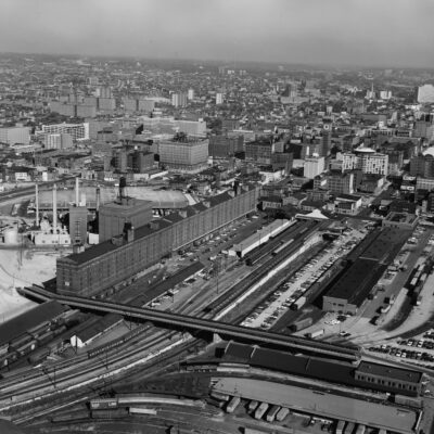 AERIAL VIEW OF STATION, YARDS AND BONDED WAREHOUSE, LOOKING NORTHWEST - Baltimore & Ohio Railroad, Camden Station, South side of Camden Street between Eutaw & Howard Streets, Baltimore, Independent City, MD